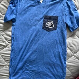 Jimmy John’s Women’s Bella Canvas Blue Short Sleeve Tee with Navy Pocket
